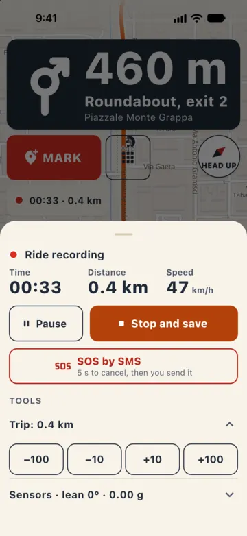 Ride recording sheet opened while navigating: time 00:33, 0.4 km, 47 km/h, Pause, Stop and save, the "SOS by SMS" button and the trip meter with −100, −10, +10, +100.