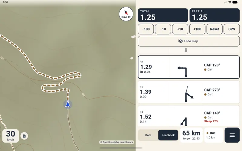 Rally roadbook on a tablet: map on the left; on the right total and partial trip with correction buttons and boxes with distance, tulip, heading and surface.
